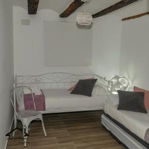 A bed or beds in a room at CASA LO PASTELER