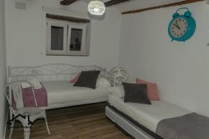 A bed or beds in a room at CASA LO PASTELER