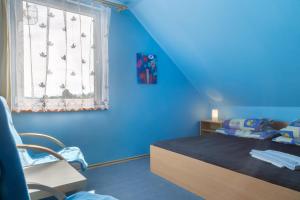 A bed or beds in a room at Pěkná Vyhlídka