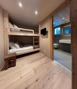 Voodi või voodid majutusasutuse Hotel Les Flocons toas
