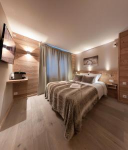 Giường trong phòng chung tại Hotel Les Flocons