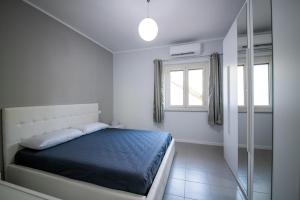 A bed or beds in a room at Residence l'Ogliastro