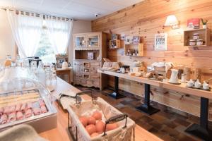 a kitchen with wooden walls and a counter with eggs on it at Hotel Les Flocons in Les Deux Alpes