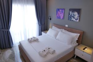 Postel nebo postele na pokoji v ubytování Blue Water Hotel Ksamil