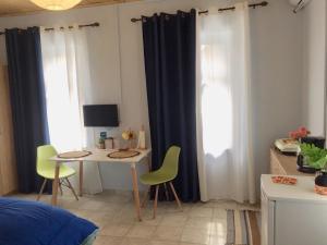 A television and/or entertainment centre at Traditional House “AVLI”