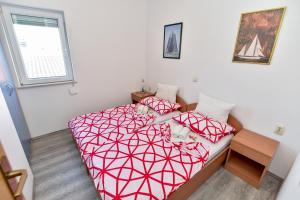 Postel nebo postele na pokoji v ubytování Apartmani LUNA