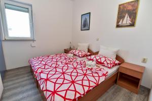 Postel nebo postele na pokoji v ubytování Apartmani LUNA