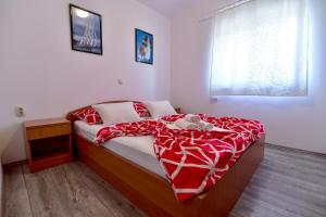 Postel nebo postele na pokoji v ubytování Apartmani LUNA