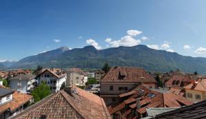 a view of a town with mountains in the background at viaDolceVita - Blaue Gästewohnung in Lana