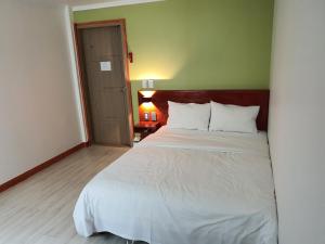 Postel nebo postele na pokoji v ubytování K Guesthouse