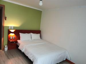 Postel nebo postele na pokoji v ubytování K Guesthouse