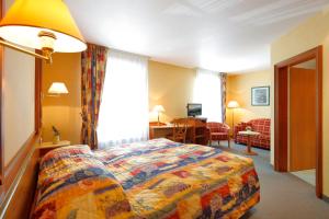 Letto o letti in una camera di Hotel Gruber
