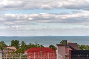 a view of the ocean from a city with houses at Atmosfera Hotel in Odesa