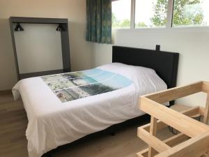 Ліжко або ліжка в номері Vakantiewoning De Zandkorrel