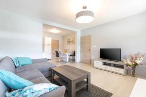 a living room with a couch and a tv at Niki in Labin