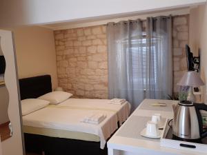 Postel nebo postele na pokoji v ubytování Carol Rooms