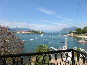 a view of a harbor with boats in the water at La Baia in Stresa