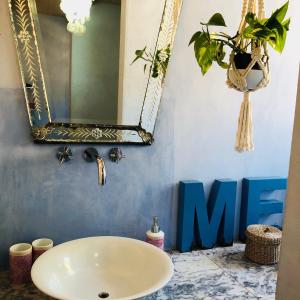 a bathroom with a sink and a mirror at Wild Oasis - Algarve in Monchique