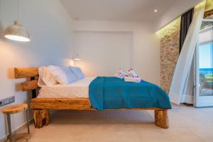 A bed or beds in a room at The Beach House Kaminaki