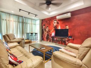 a living room with couches and a movie poster on the wall at KSL City Mall Johor Bahru MARVEL in Johor Bahru