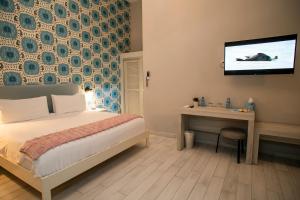 Postel nebo postele na pokoji v ubytování Trópica Beach Hotel