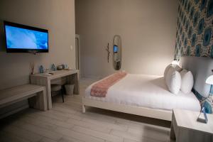 Postel nebo postele na pokoji v ubytování Trópica Beach Hotel