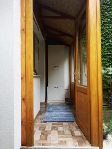 an open door of a house with a porch at Centar in Subotica