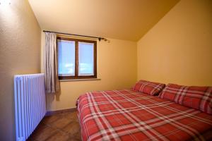 Postel nebo postele na pokoji v ubytování Agriturismo L'Ciabot