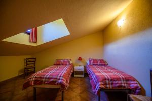 Postel nebo postele na pokoji v ubytování Agriturismo L'Ciabot