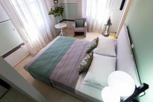 Postel nebo postele na pokoji v ubytování Magnolia - Apartment in Kalamata