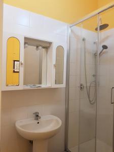 a bathroom with a sink and a shower at My Trevi Rooms 88 in Rome +15 photos