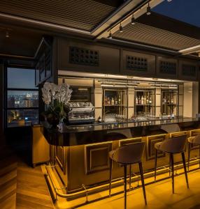 a bar in a restaurant with chairs and tables at Azzap Hotel Galata in Istanbul