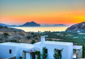 a view of the island of santorini at sunset at Villa Handras-Ulivo & Mandorlo, by Amorgos Holiday Homes in Aegiali