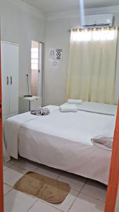 Pousada Manaíra Buena Playa tesisinde bir odada yatak veya yataklar