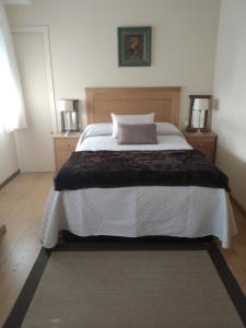 Postel nebo postele na pokoji v ubytování apartamento pettit centro de O Grove