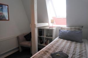 Postel nebo postele na pokoji v ubytování Hoffmanns Holsteinisches Haus