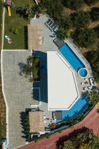 an overhead view of a swimming pool with a pool house at Chara Sensory Luxury Villa with Heated Pool & Gym, By ThinkVilla in Panormos Rethymno