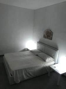 Postel nebo postele na pokoji v ubytování Casa vacanza le tre palme