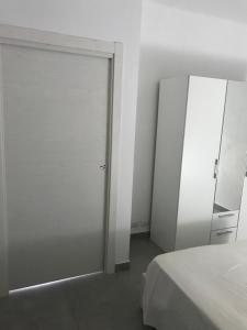 Postel nebo postele na pokoji v ubytování Casa vacanza le tre palme