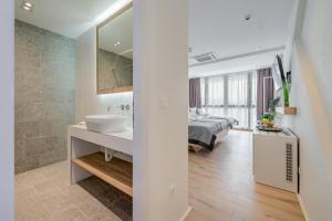 Ένα ή περισσότερα κρεβάτια σε δωμάτιο στο Hotel Pax
