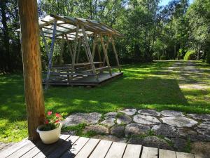 a gazebo sitting on top of a yard at Marta-Lovise puhkemaja Kristiine in Kipi