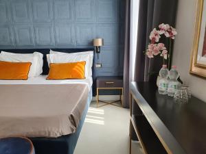 Postel nebo postele na pokoji v ubytování Hotel Maxim Axial