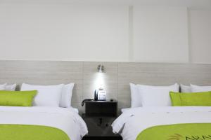 Postel nebo postele na pokoji v ubytování Arame Hotel