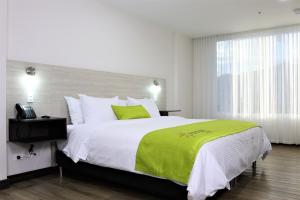Postel nebo postele na pokoji v ubytování Arame Hotel