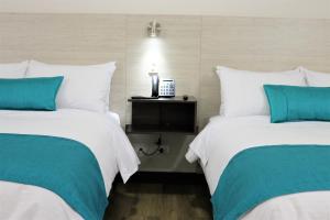 Postel nebo postele na pokoji v ubytování Arame Hotel