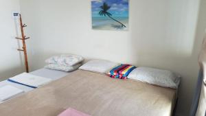 a bed in a room with at Pousada Areal Barra Grande Maragogi AL in Maragogi