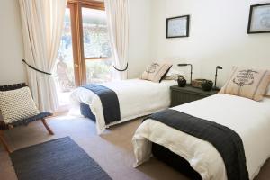 
A bed or beds in a room at Arcadian Retreat
