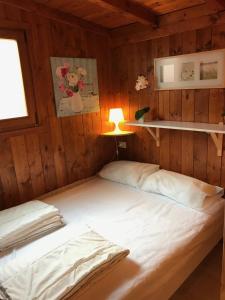 Voodi või voodid majutusasutuse Mylooking vacanze Porlezza toas