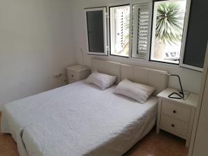 Кровать или кровати в номере Villa Tranquila