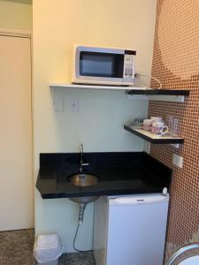 A cozinha ou cozinha compacta de Vila Stellino Suítes